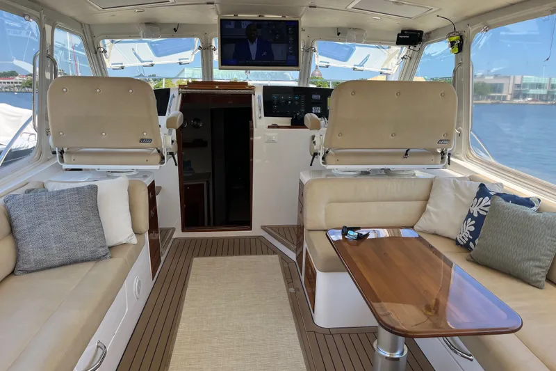 Slide: The Image of Luxurious interior of a 2016 MJM 50z yacht with plush seating and elegant wood finishes. - 8
