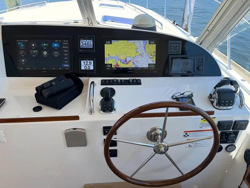 Slide: The Image of Helm of 2016 MJM 50z yacht with navigation screens and steering wheel. - 9