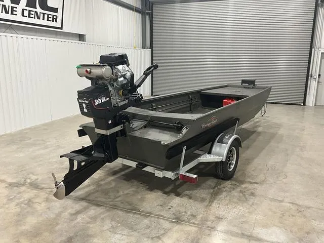 Slide: The Image of 2025 Gator Tail 1748 Gator Series boat in a garage, featuring a powerful motor. - 4