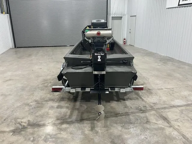 Slide: The Image of 2025 Gator Tail 1748 Gator Series boat in a garage, rear view. - 5