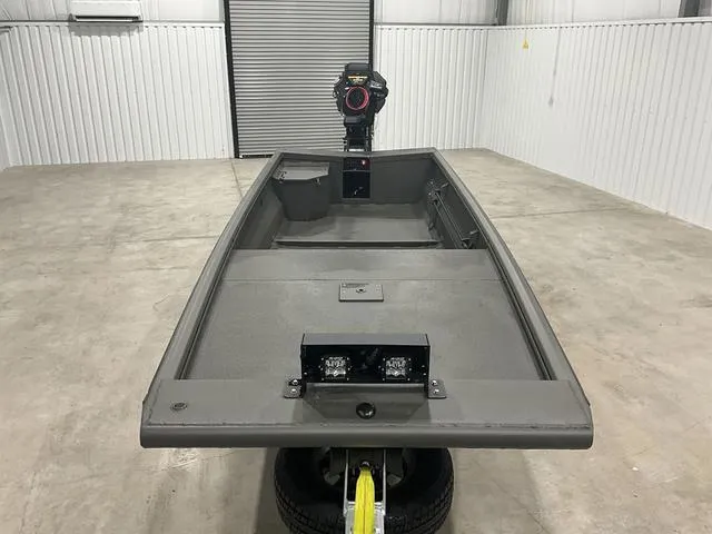 Slide: The Image of 2025 Gator Tail 1748 Gator Series boat in a garage, showcasing sleek design and motor. - 8