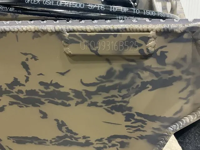 Slide: The Image of 2025 Gator Tail 1860 Extreme series boat with camouflage pattern and visible serial number. - 13