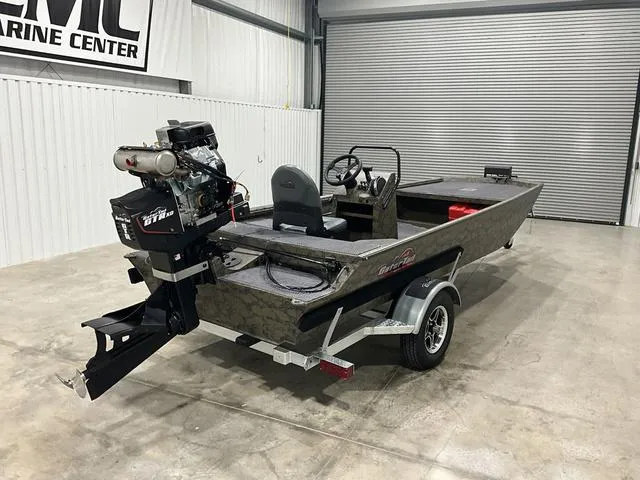 Slide: The Image of 2025 Gator Tail 1860 Extreme series boat in a showroom, featuring a powerful outboard motor. - 3