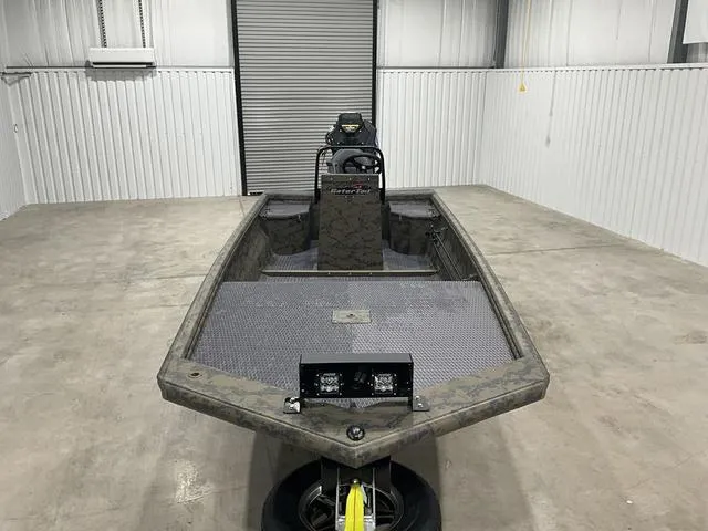 Slide: The Image of 2025 Gator Tail 1860 Extreme series boat in a garage, front view. - 8