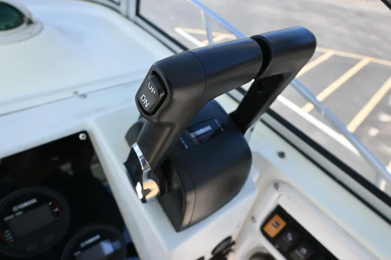 Slide: The Image of Throttle control on a 1998 World Cat 266 SC boat dashboard. - 10
