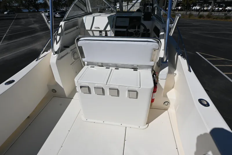 Slide: The Image of 1998 World Cat 266 SC boat interior with seating and control panel. - 11
