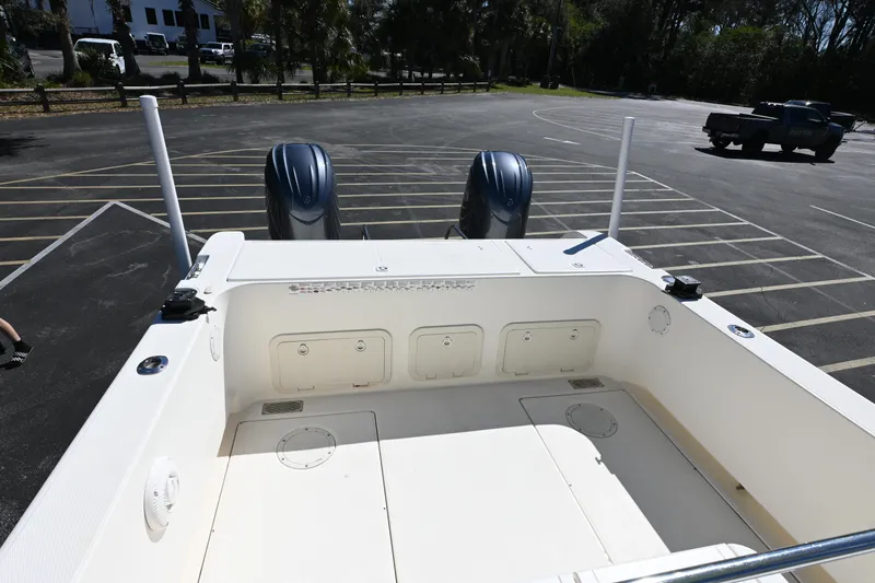 Slide: The Image of 1998 World Cat 266 SC boat with dual engines in a parking lot. - 12