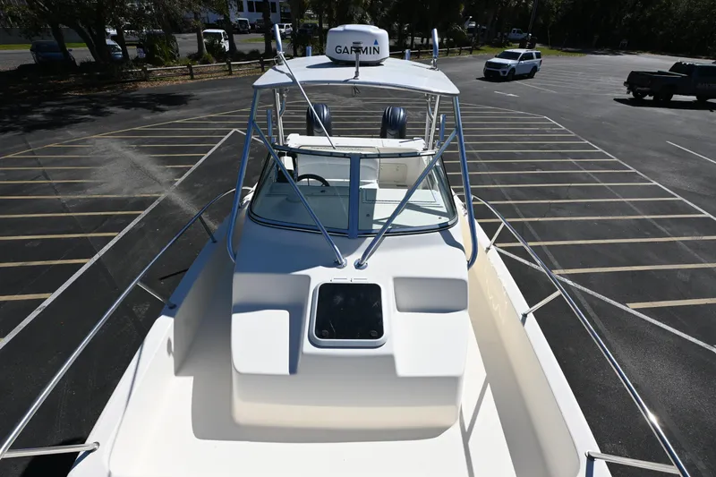 Slide: The Image of 1998 World Cat 266 SC boat in parking lot, featuring Garmin equipment. - 7