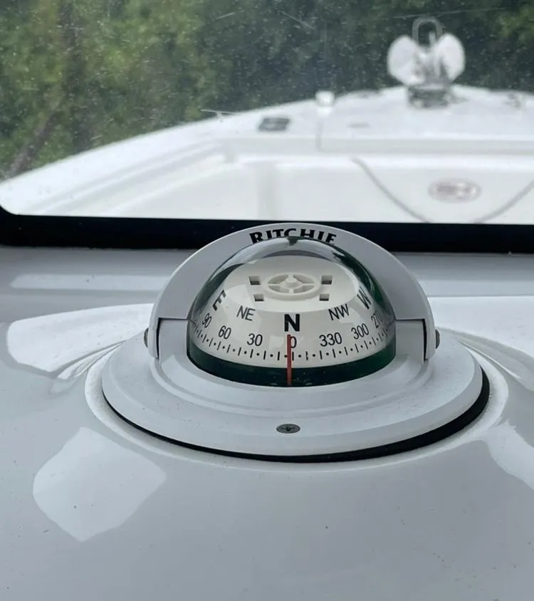 Slide: The Image of Compass on 2018 Sea Hunt Gamefish 25 boat dashboard, showing north direction. - 14