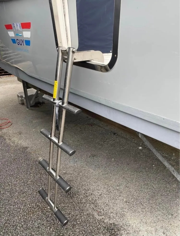 Slide: The Image of 2018 Sea Hunt Gamefish 25 with stainless steel boarding ladder on the side. - 18