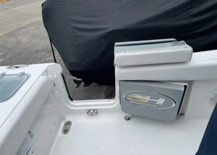Slide: The Image of 2018 Sea Hunt Gamefish 25 boat interior with SH logo and covered area. - 19