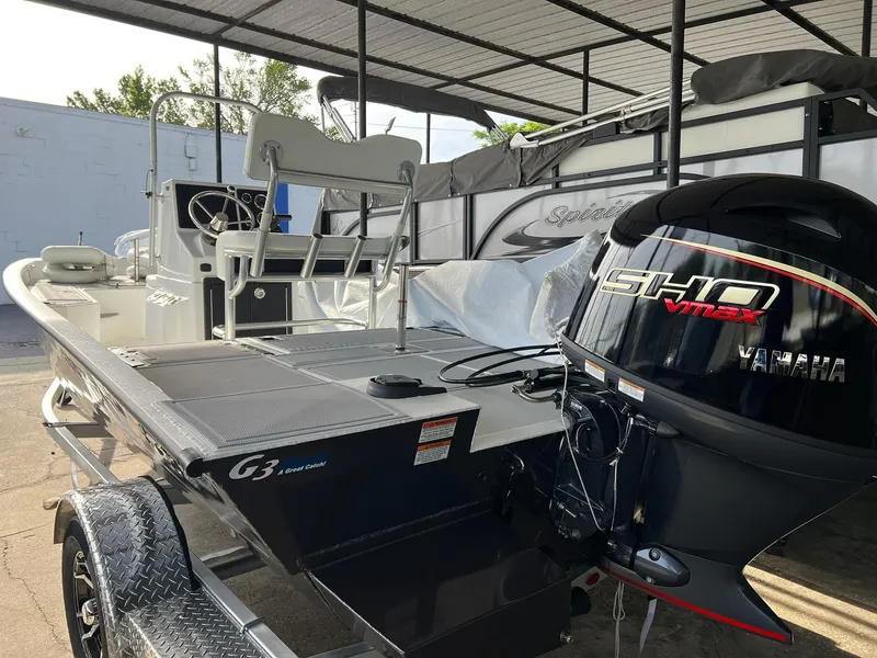 Slide: The Image of 2025 G3 Bay 19 GX boat interior with seating and controls. - 10