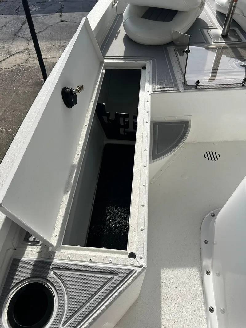 Slide: The Image of Open storage compartment on 2025 G3 Bay 19 GX boat deck. - 7