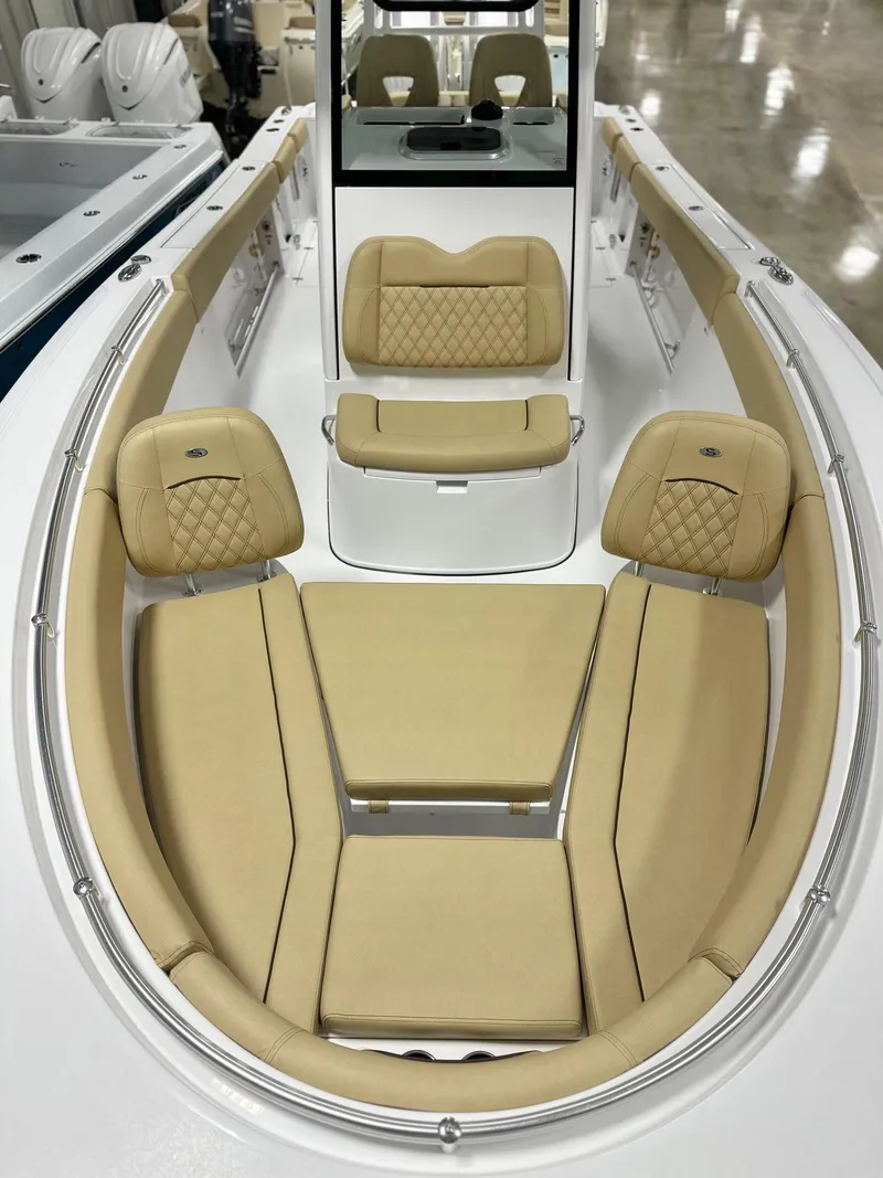 Slide: The Image of 2025 Sportsman Open 282 Center Console with tan cushioned seating and sleek design. - 10