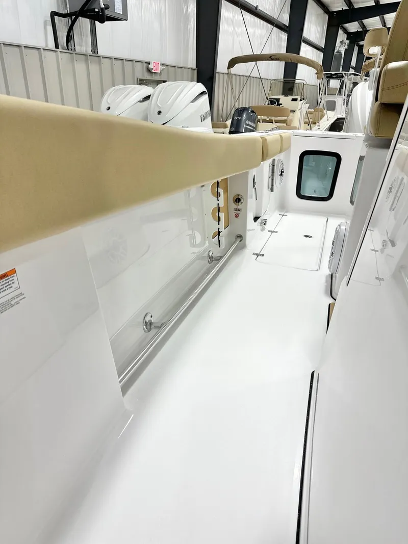 Slide: The Image of 2025 Sportsman Open 282 Center Console boat interior with sleek white design and modern features. - 13