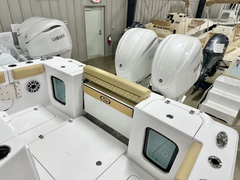 Slide: The Image of 2025 Sportsman Open 282 Center Console boat with Yamaha engines in showroom. - 14