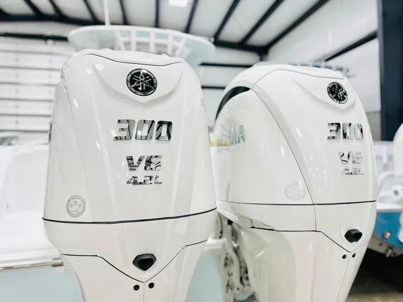 Slide: The Image of Twin Yamaha 300 V6 outboard engines on a 2025 Sportsman Open 282 Center Console boat. - 18