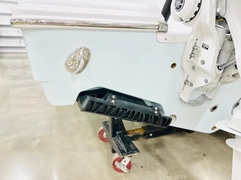Slide: The Image of 2025 Sportsman Open 282 Center Console boat detail with motor mount and step. - 19