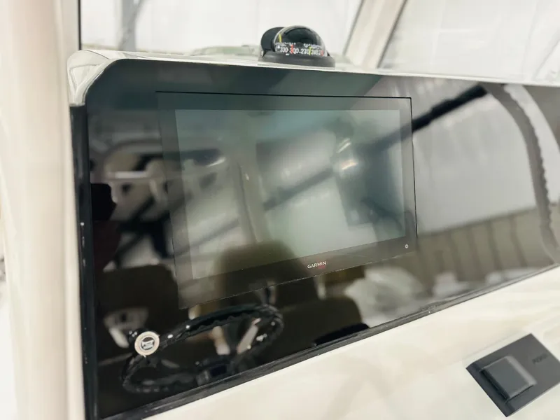 Slide: The Image of 2025 Sportsman Open 282 Center Console dashboard with touchscreen display. - 3