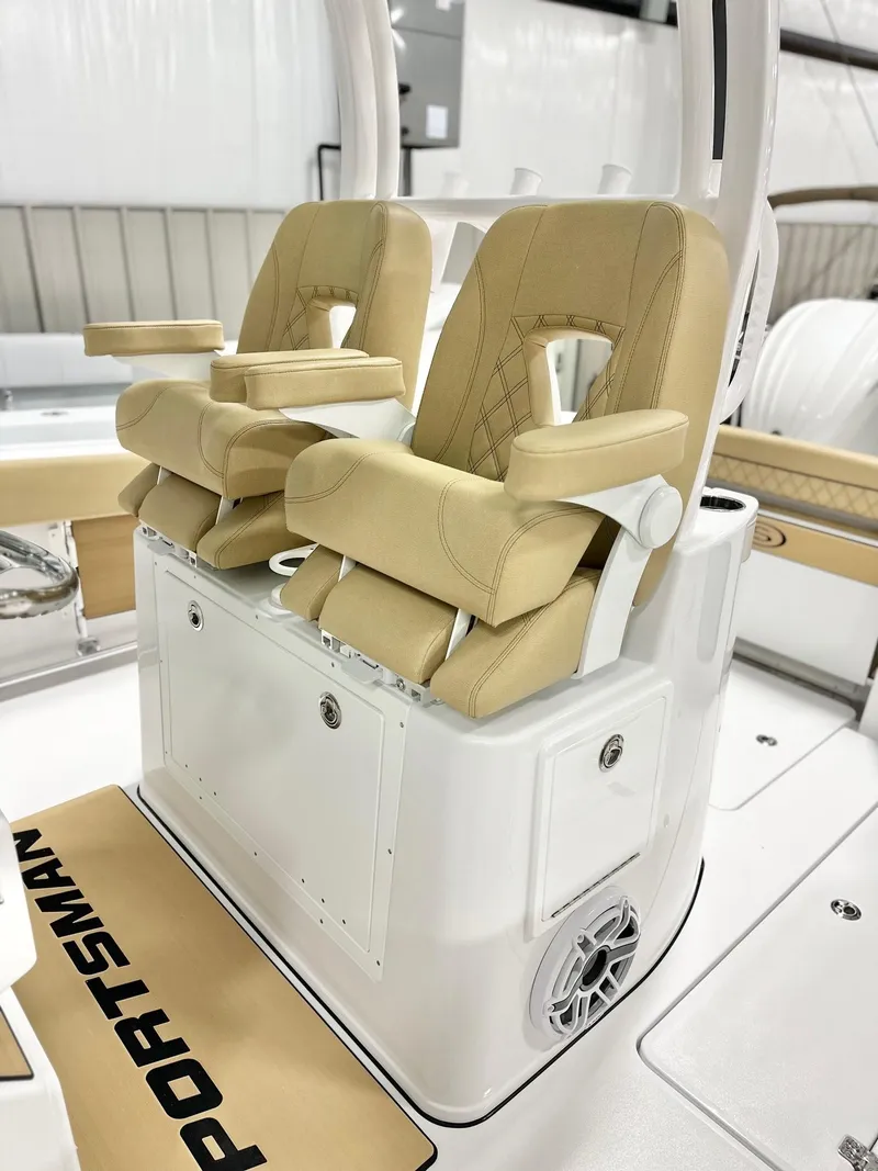 Slide: The Image of 2025 Sportsman Open 282 Center Console with beige cushioned seats and armrests. - 4