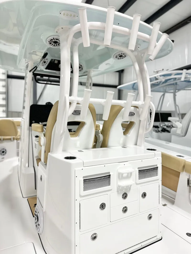 Slide: The Image of 2025 Sportsman Open 282 Center Console boat interior with seating and storage. - 5