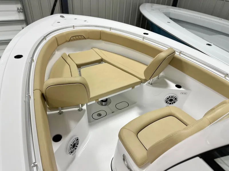 Slide: The Image of 2025 Sportsman Open 282 Center Console boat with beige seating and modern design. - 8