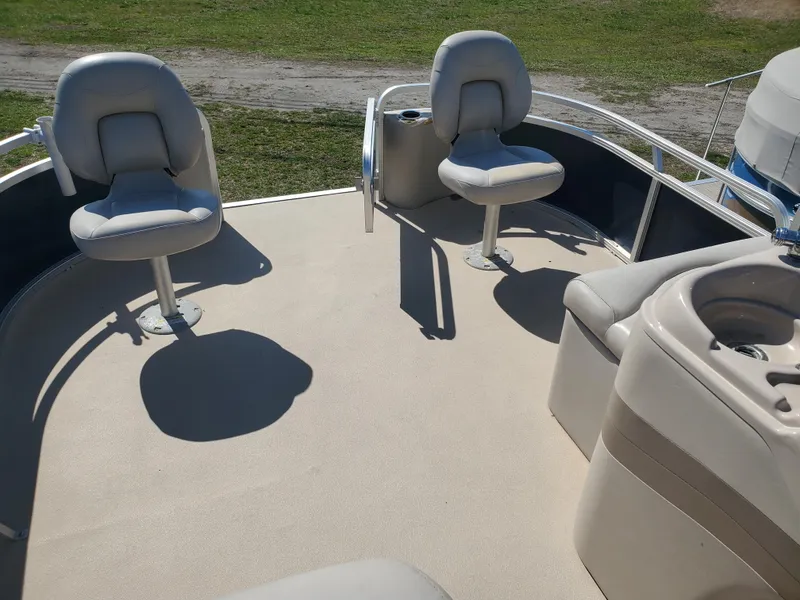 Slide: The Image of 2012 Starcraft Stardeck 206 4PT boat interior with swivel seats and console. - 1