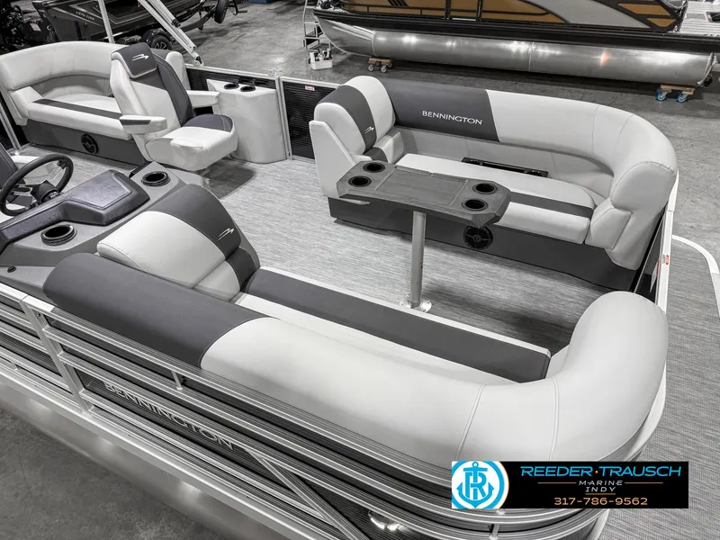 Slide: The Image of 2025 Bennington 20 SSR pontoon boat interior with gray seating and table. - 13