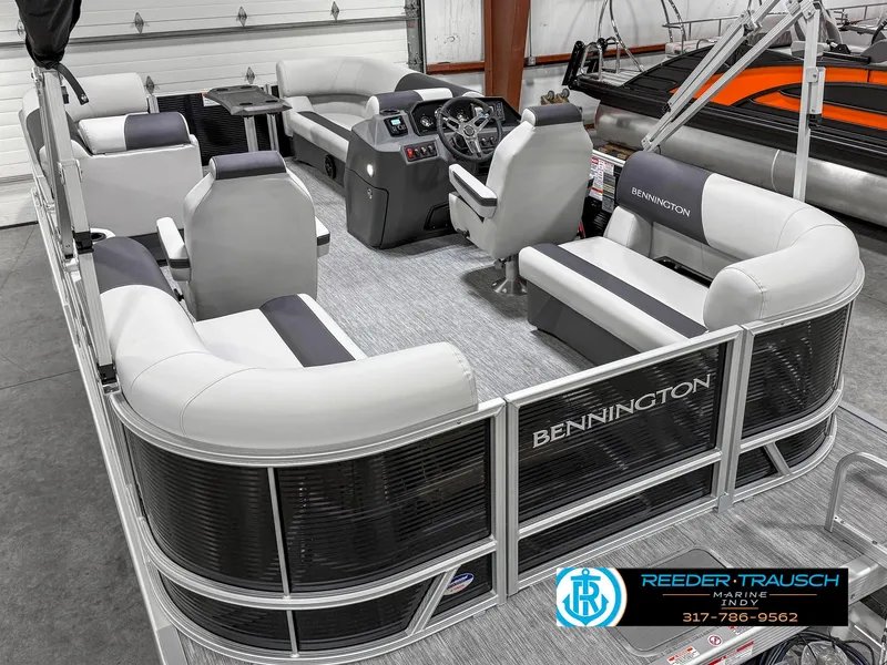 Slide: The Image of 2025 Bennington 20 SSR pontoon boat interior with modern seating and steering console. - 15