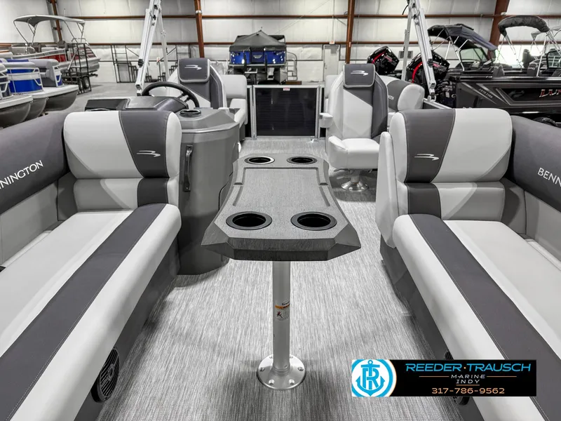 Slide: The Image of 2025 Bennington 20 SSR pontoon boat interior with gray seating and central table. - 16