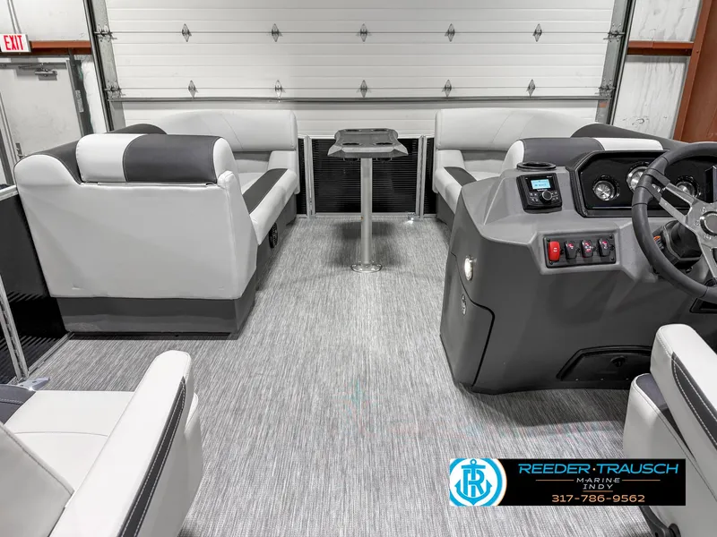 Slide: The Image of 2025 Bennington 20 SSR pontoon boat interior with modern seating and control console. - 20