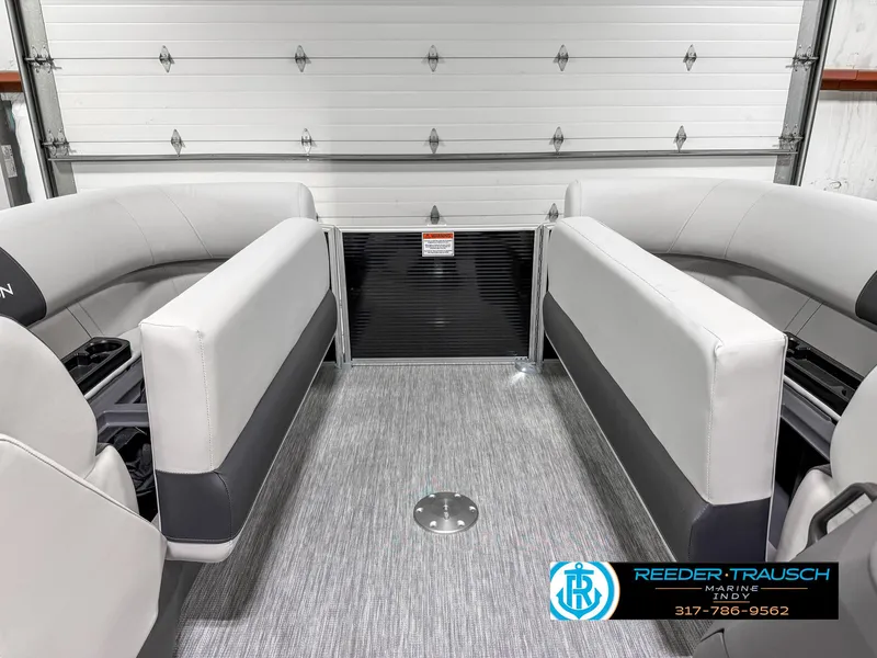 Slide: The Image of 2025 Bennington 20 SSR pontoon boat interior with gray seating and flooring. - 23
