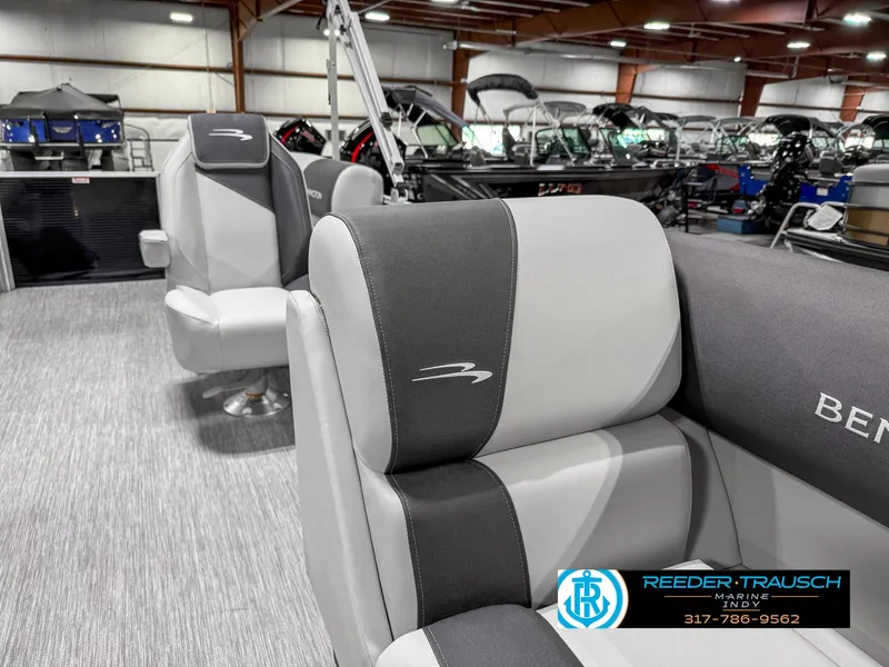 Slide: The Image of 2025 Bennington 20 SSR boat interior with gray seating at Reeder-Trausch Marine showroom. - 24