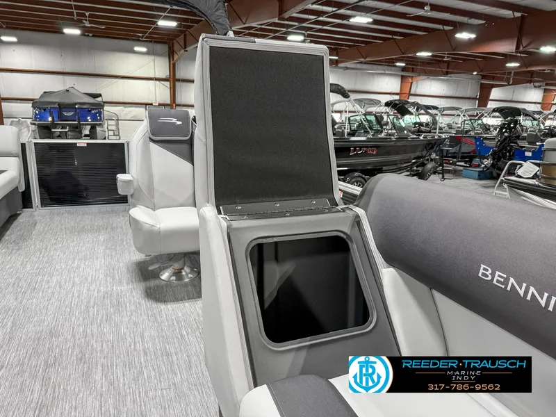 Slide: The Image of 2025 Bennington 20 SSR boat interior with open storage compartment, showcasing seating and modern design. - 25