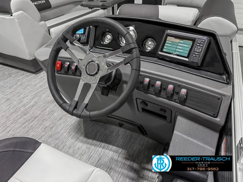 Slide: The Image of 2025 Bennington 20 SSR boat dashboard with steering wheel and control panel. - 28