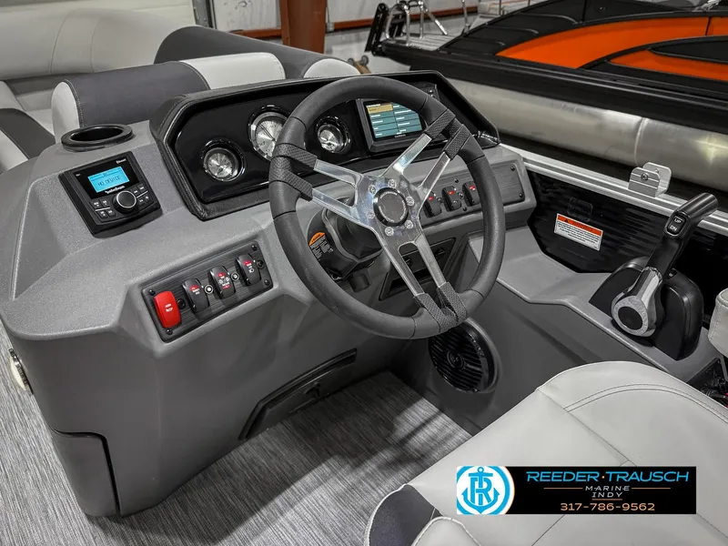 Slide: The Image of 2025 Bennington 20 SSR boat dashboard with steering wheel and control panel. - 29