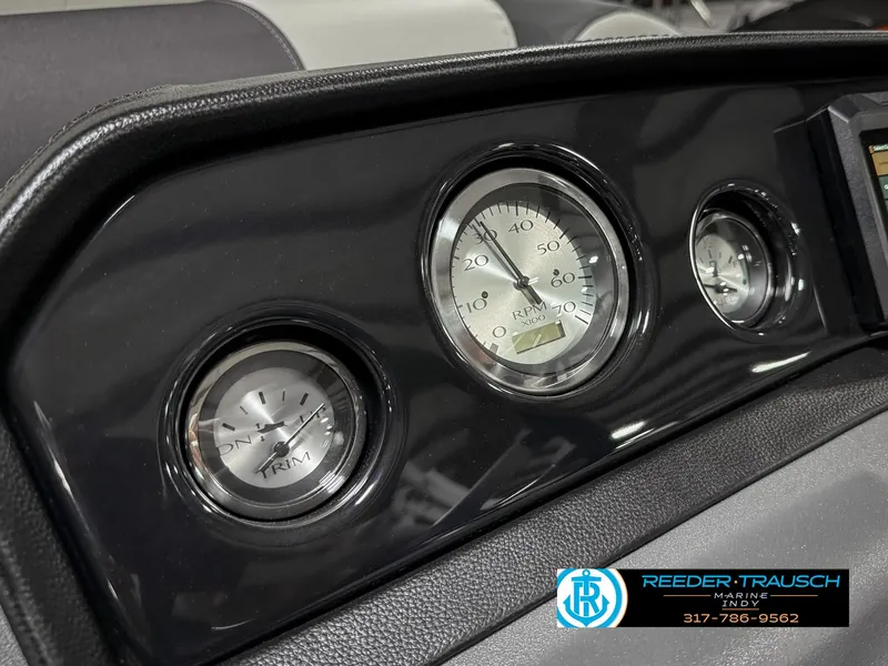 Slide: The Image of Dashboard of 2025 Bennington 20 SSR boat with gauges and Reeder-Trausch Marine logo. - 33