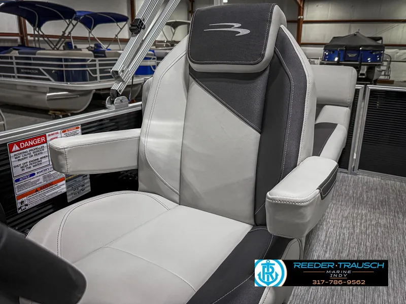 Slide: The Image of 2025 Bennington 20 SSR boat seat with sleek design in showroom setting. - 36