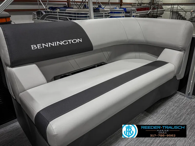 Slide: The Image of 2025 Bennington 20 SSR boat seating with gray and black upholstery in showroom. - 37