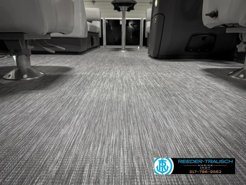 Slide: The Image of 2025 Bennington 20 SSR interior with gray carpet and seating, showcasing modern design. - 42