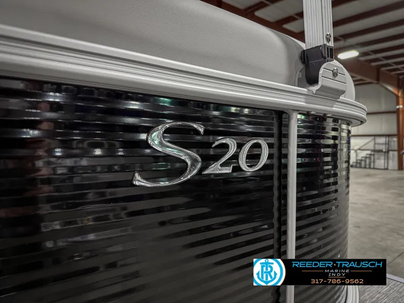 Slide: The Image of 2025 Bennington 20 SSR pontoon boat with sleek black exterior in a showroom. - 45