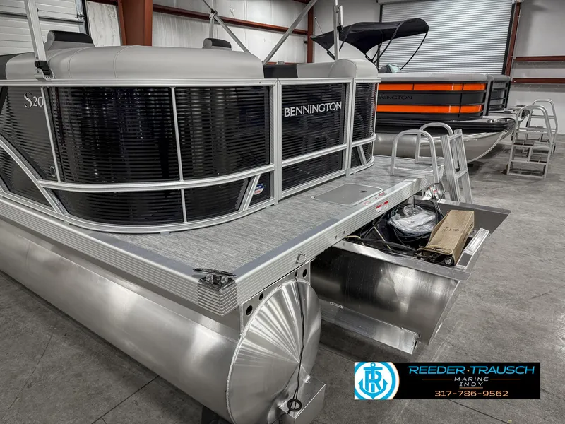 Slide: The Image of 2025 Bennington 20 SSR pontoon boat in showroom, featuring sleek design and modern amenities. - 46