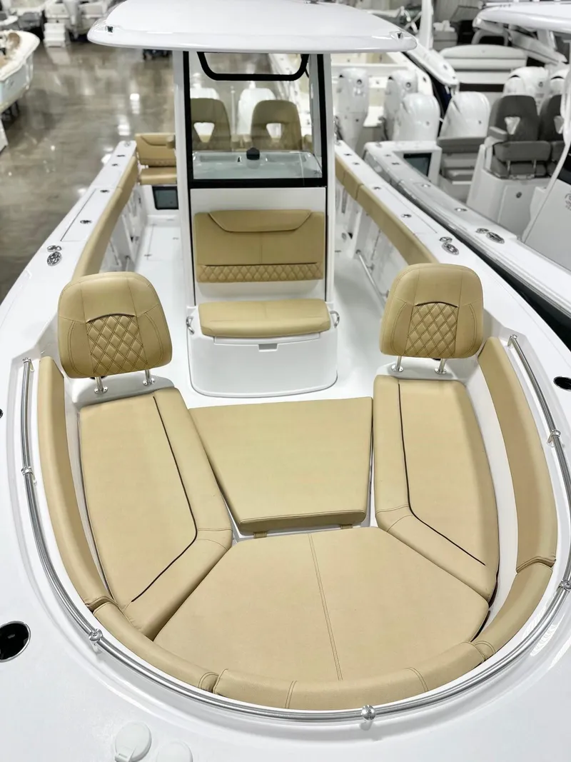 Slide: The Image of 2025 Sportsman Heritage 261 boat with beige seating and modern design. - 12