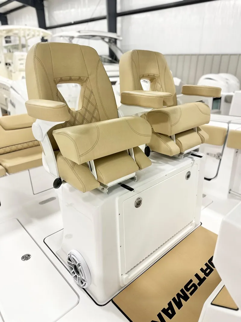 Slide: The Image of 2025 Sportsman Heritage 261 boat with luxurious tan seating and modern design. - 4