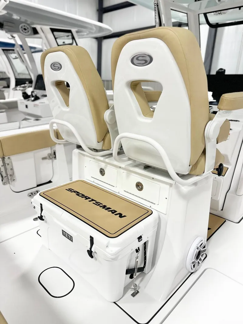 Slide: The Image of 2025 Sportsman Heritage 261 boat seats with integrated cooler in a sleek design. - 5