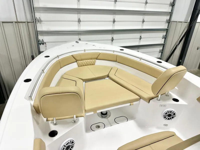 Slide: The Image of 2025 Sportsman Heritage 261 boat interior with tan seating and modern design. - 9