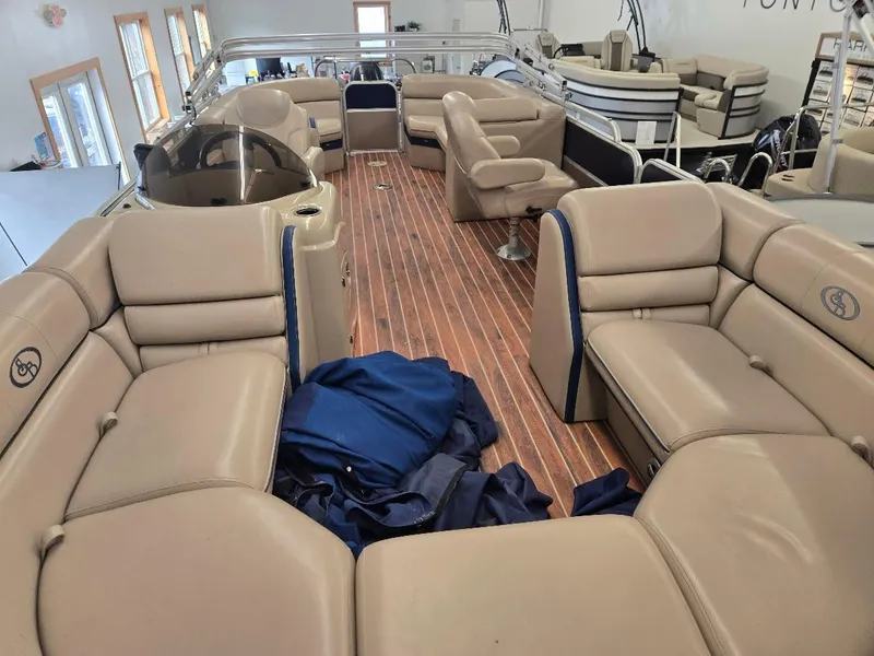 Slide: The Image of 2014 South Bay 522R pontoon boat with spacious seating and wooden deck. - 2