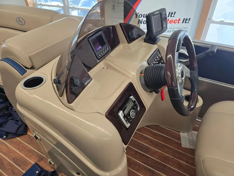 Slide: The Image of 2014 South Bay 522R boat dashboard with steering wheel and controls. - 6