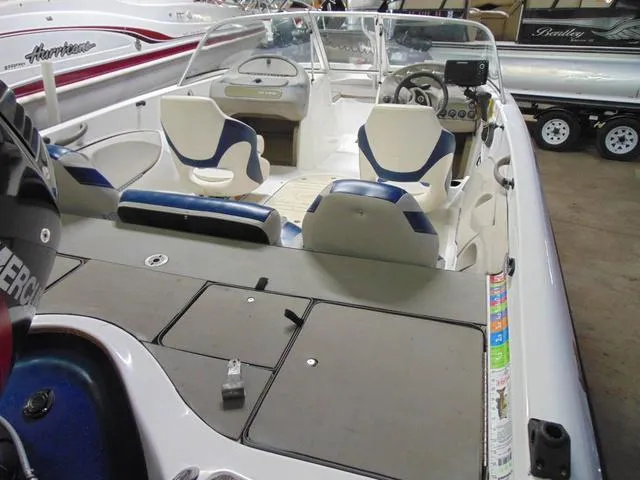 Slide: The Image of 2002 Nitro 188 Fish And Ski boat interior with seating and dashboard. - 6
