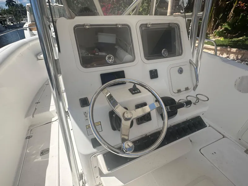 Slide: The Image of 2005 Century 3200 Center Console boat steering wheel and control panel. - 15